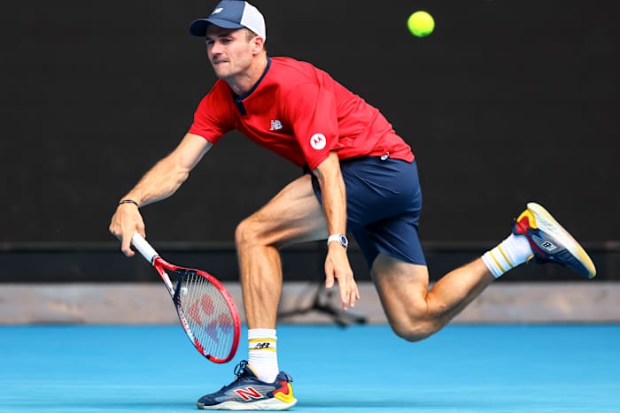 Tommy Paul returns a serve during the 2024 Australian Open.